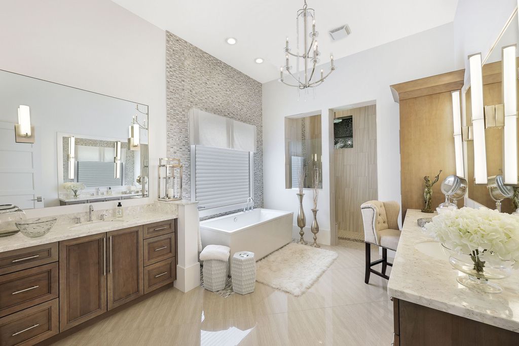 26171 Woodlyn Drive, Bonita Springs, Florida is a contemporary masterpiece with every detail considered for style and comfort, Luxury features include honed porcelain tile, whitewashed oak flooring, state of the art kitchen, stunning wet bar & fireplace, outdoor kitchen, custom pool, outdoor fireplace, and much more.