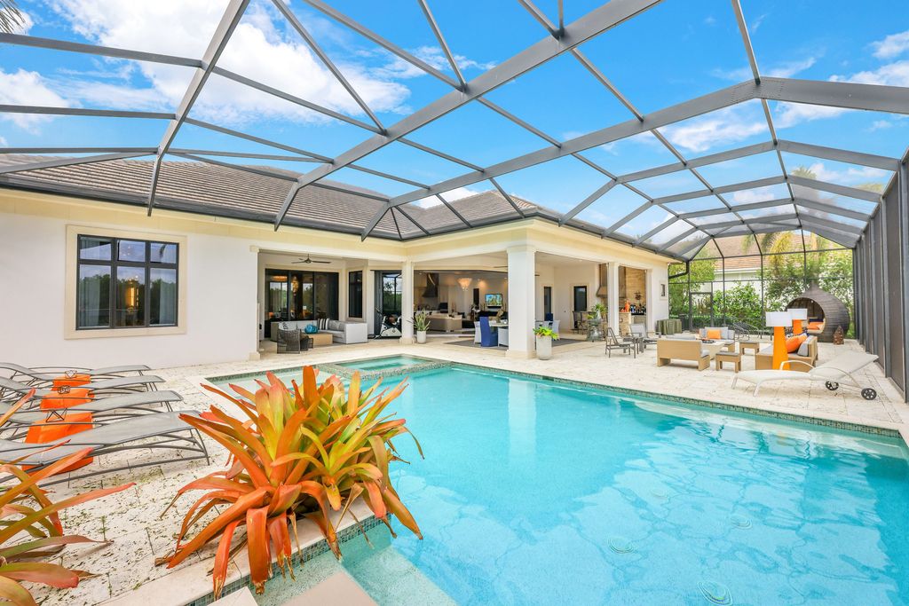 26171 Woodlyn Drive, Bonita Springs, Florida is a contemporary masterpiece with every detail considered for style and comfort, Luxury features include honed porcelain tile, whitewashed oak flooring, state of the art kitchen, stunning wet bar & fireplace, outdoor kitchen, custom pool, outdoor fireplace, and much more.
