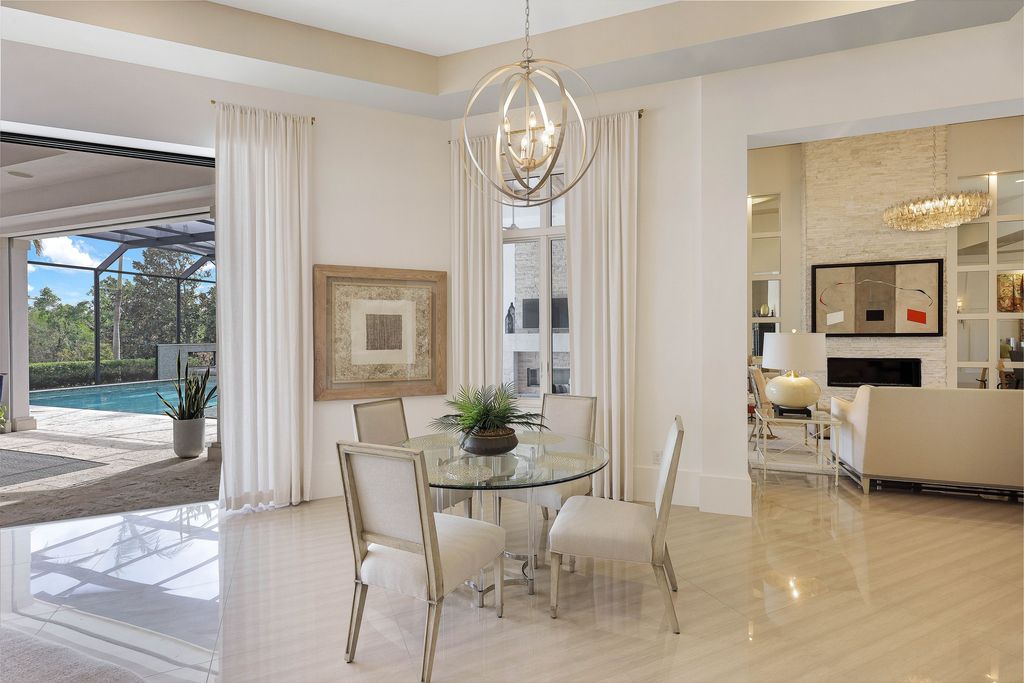 26171 Woodlyn Drive, Bonita Springs, Florida is a contemporary masterpiece with every detail considered for style and comfort, Luxury features include honed porcelain tile, whitewashed oak flooring, state of the art kitchen, stunning wet bar & fireplace, outdoor kitchen, custom pool, outdoor fireplace, and much more.