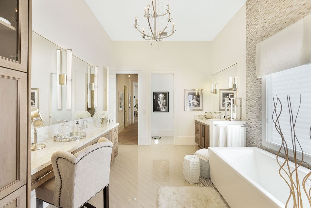 26171 Woodlyn Drive, Bonita Springs, Florida is a contemporary masterpiece with every detail considered for style and comfort, Luxury features include honed porcelain tile, whitewashed oak flooring, state of the art kitchen, stunning wet bar & fireplace, outdoor kitchen, custom pool, outdoor fireplace, and much more.