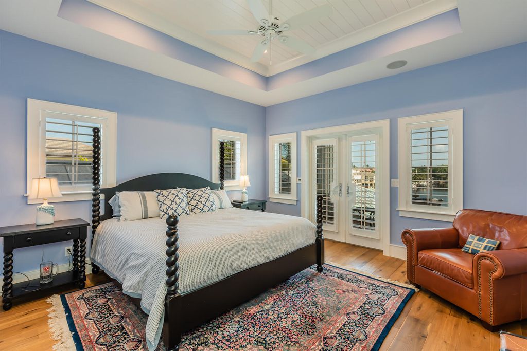 481 21st Ave S, Naples, Florida is a one-of-a-kind estate nestled along the widest canal in Aqualane Shore with hardwood flooring, shiplap siding and outstanding finishes, enhanced by mesmerizing water views.