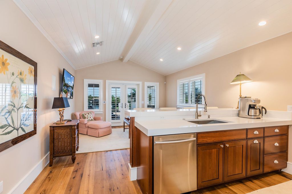 481 21st Ave S, Naples, Florida is a one-of-a-kind estate nestled along the widest canal in Aqualane Shore with hardwood flooring, shiplap siding and outstanding finishes, enhanced by mesmerizing water views.