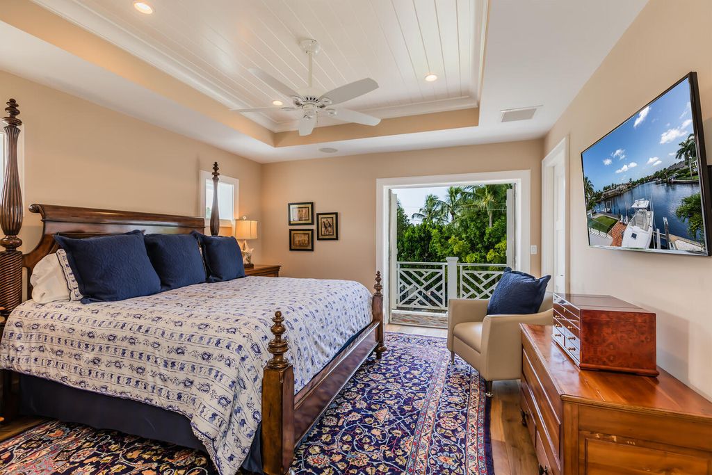 481 21st Ave S, Naples, Florida is a one-of-a-kind estate nestled along the widest canal in Aqualane Shore with hardwood flooring, shiplap siding and outstanding finishes, enhanced by mesmerizing water views.