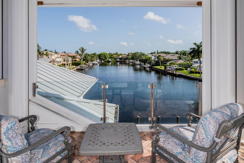 481 21st Ave S, Naples, Florida is a one-of-a-kind estate nestled along the widest canal in Aqualane Shore with hardwood flooring, shiplap siding and outstanding finishes, enhanced by mesmerizing water views.