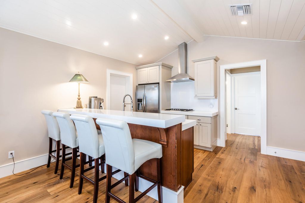 481 21st Ave S, Naples, Florida is a one-of-a-kind estate nestled along the widest canal in Aqualane Shore with hardwood flooring, shiplap siding and outstanding finishes, enhanced by mesmerizing water views.