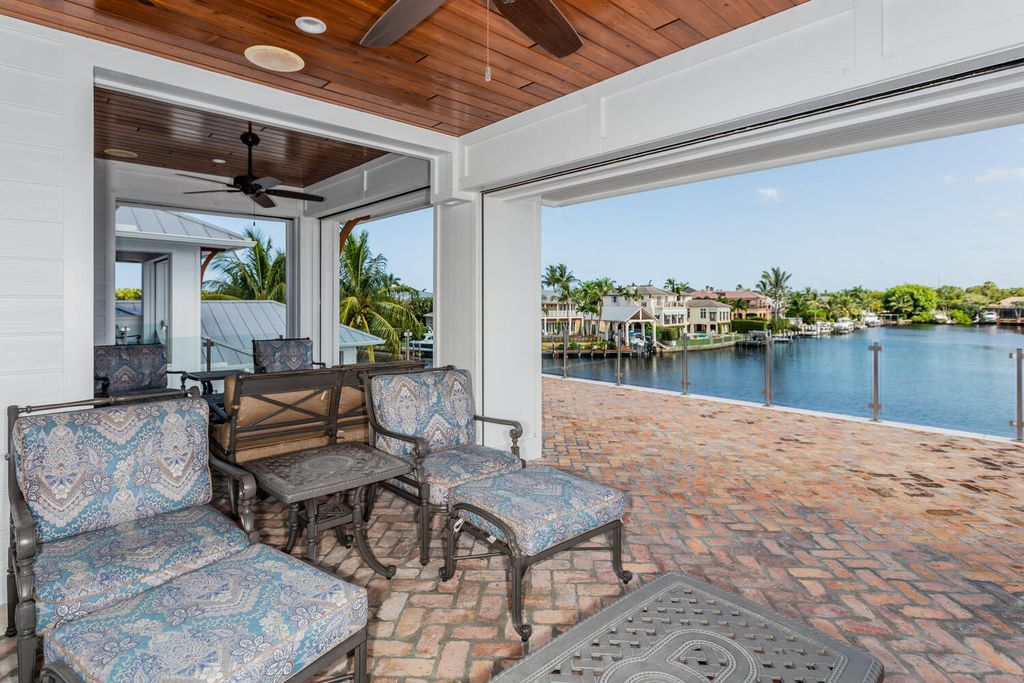 481 21st Ave S, Naples, Florida is a one-of-a-kind estate nestled along the widest canal in Aqualane Shore with hardwood flooring, shiplap siding and outstanding finishes, enhanced by mesmerizing water views.