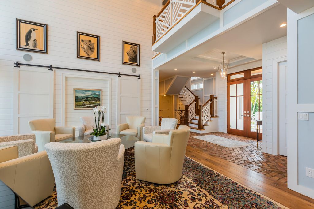 481 21st Ave S, Naples, Florida is a one-of-a-kind estate nestled along the widest canal in Aqualane Shore with hardwood flooring, shiplap siding and outstanding finishes, enhanced by mesmerizing water views.