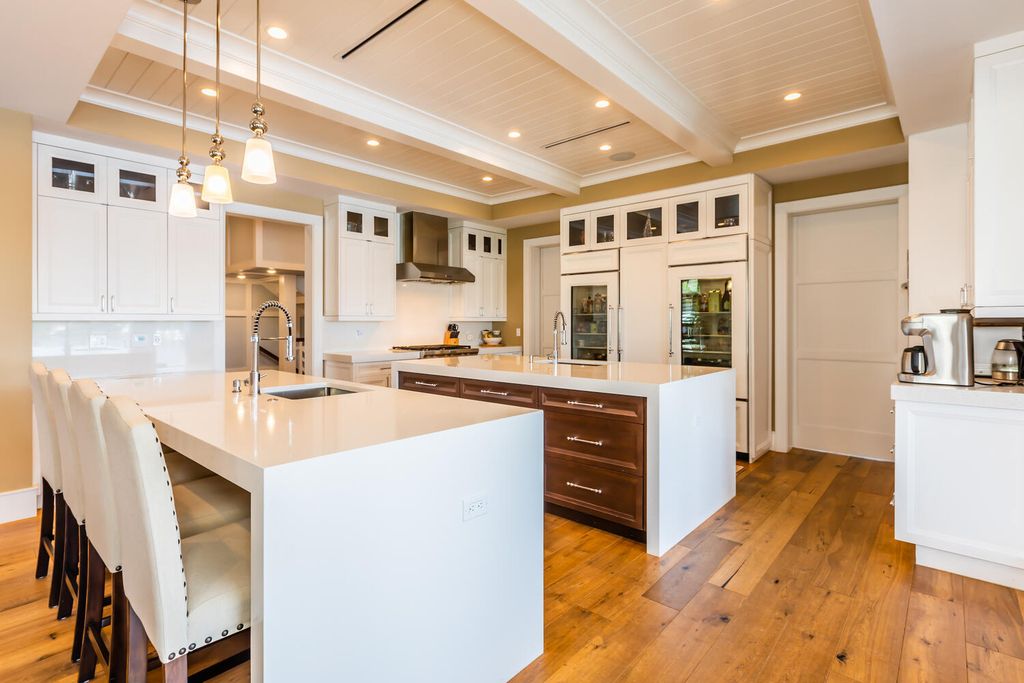 481 21st Ave S, Naples, Florida is a one-of-a-kind estate nestled along the widest canal in Aqualane Shore with hardwood flooring, shiplap siding and outstanding finishes, enhanced by mesmerizing water views.