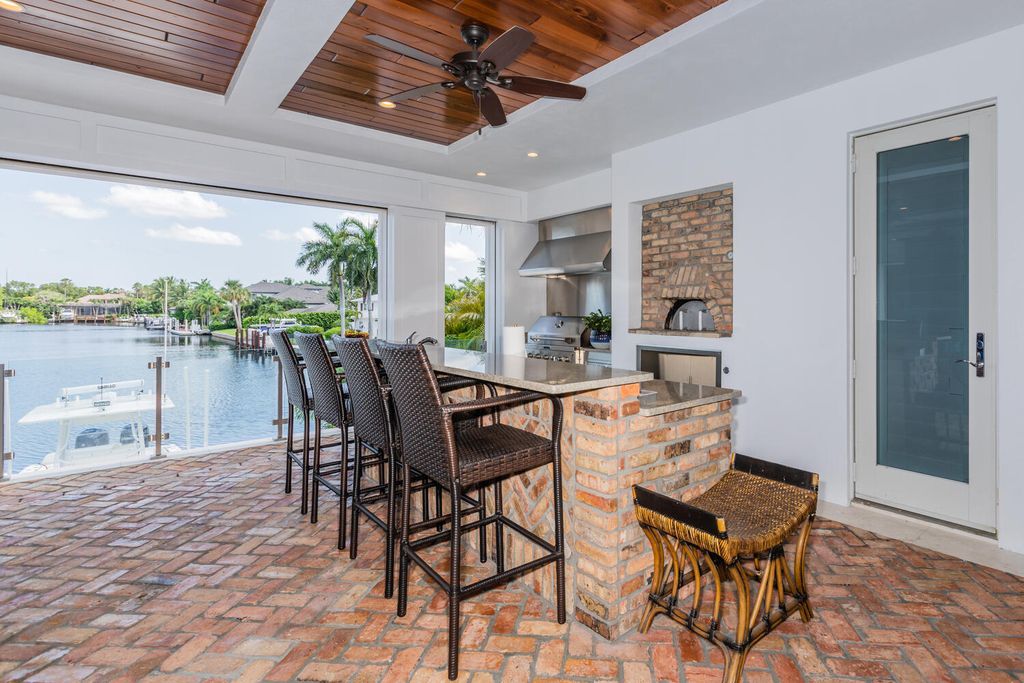 481 21st Ave S, Naples, Florida is a one-of-a-kind estate nestled along the widest canal in Aqualane Shore with hardwood flooring, shiplap siding and outstanding finishes, enhanced by mesmerizing water views.