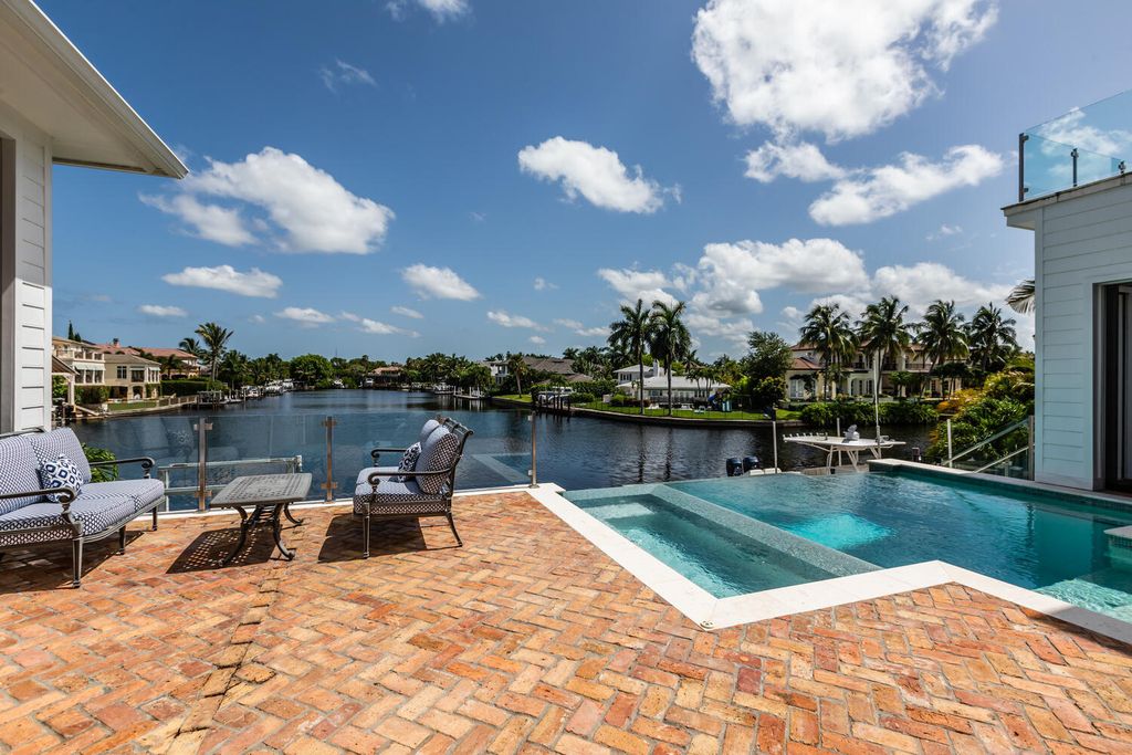 481 21st Ave S, Naples, Florida is a one-of-a-kind estate nestled along the widest canal in Aqualane Shore with hardwood flooring, shiplap siding and outstanding finishes, enhanced by mesmerizing water views.