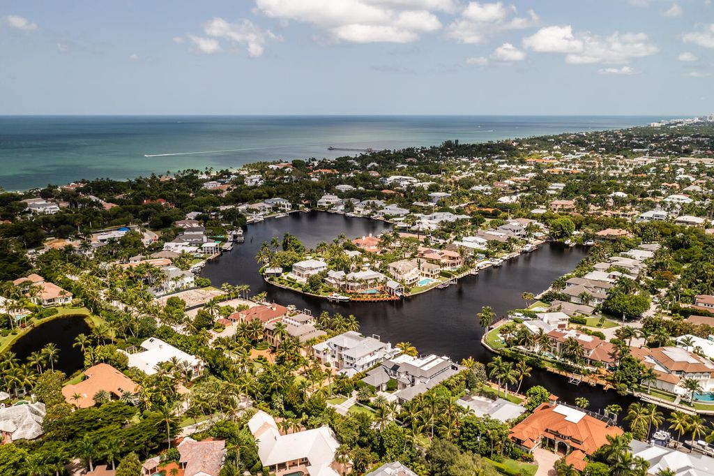 481 21st Ave S, Naples, Florida is a one-of-a-kind estate nestled along the widest canal in Aqualane Shore with hardwood flooring, shiplap siding and outstanding finishes, enhanced by mesmerizing water views.