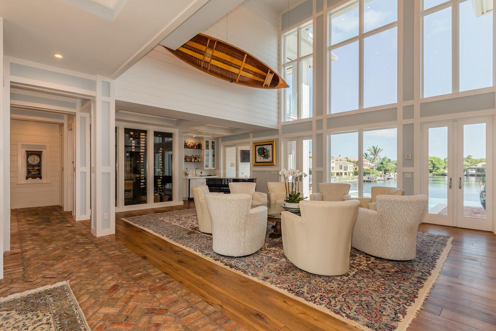 481 21st Ave S, Naples, Florida is a one-of-a-kind estate nestled along the widest canal in Aqualane Shore with hardwood flooring, shiplap siding and outstanding finishes, enhanced by mesmerizing water views.