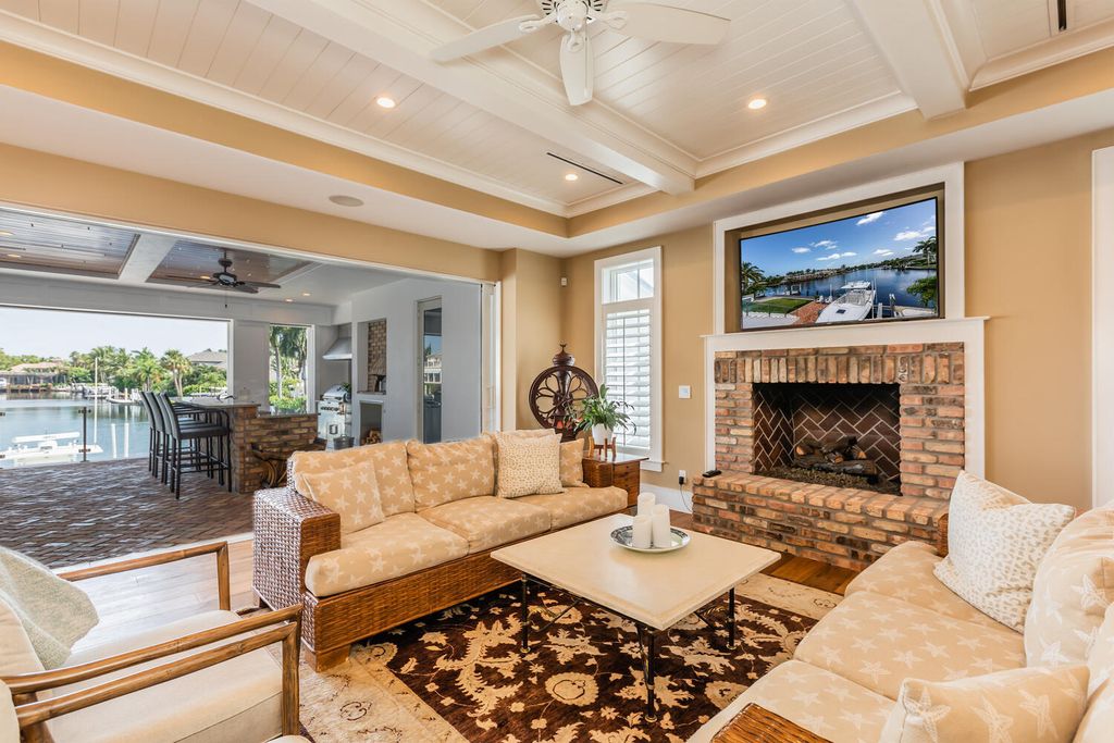 481 21st Ave S, Naples, Florida is a one-of-a-kind estate nestled along the widest canal in Aqualane Shore with hardwood flooring, shiplap siding and outstanding finishes, enhanced by mesmerizing water views.