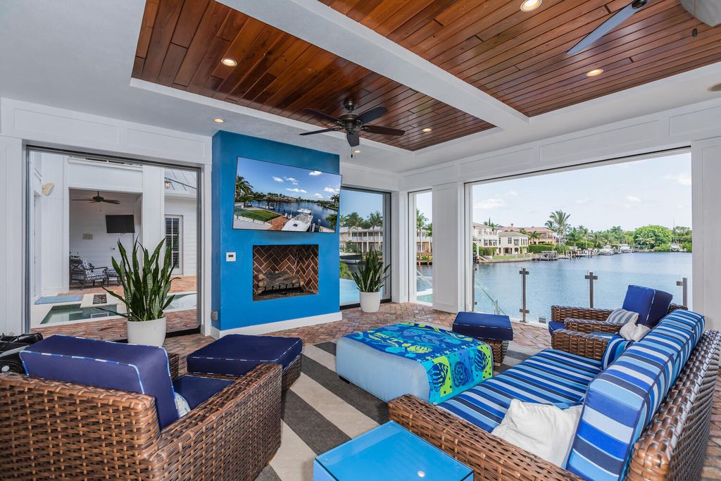481 21st Ave S, Naples, Florida is a one-of-a-kind estate nestled along the widest canal in Aqualane Shore with hardwood flooring, shiplap siding and outstanding finishes, enhanced by mesmerizing water views.