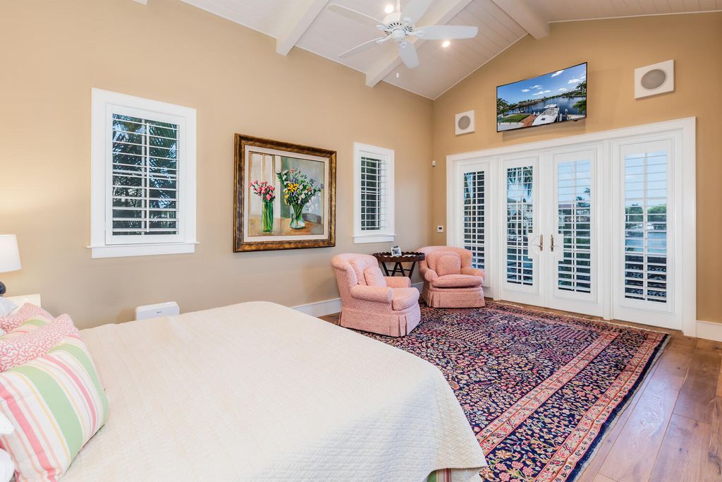481 21st Ave S, Naples, Florida is a one-of-a-kind estate nestled along the widest canal in Aqualane Shore with hardwood flooring, shiplap siding and outstanding finishes, enhanced by mesmerizing water views.