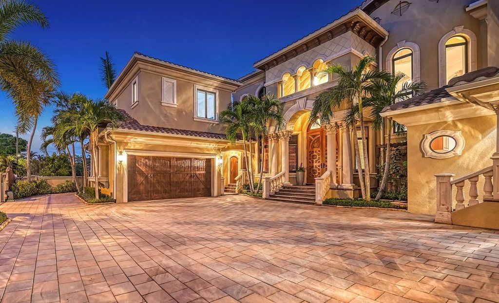 1436 John Ringling Parkway, Sarasota, Florida is a magnificent home in the coveted neighborhood of Lido Shores with impressive architectural details, beautiful chandeliers, custom woodwork, and pristine views of Sarasota Bay.