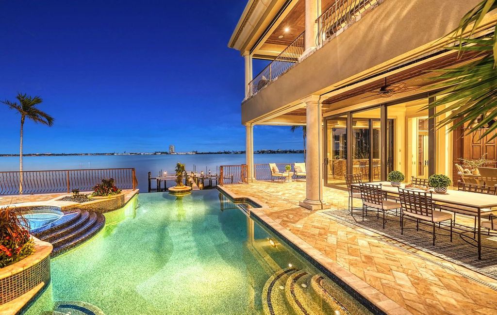 1436 John Ringling Parkway, Sarasota, Florida is a magnificent home in the coveted neighborhood of Lido Shores with impressive architectural details, beautiful chandeliers, custom woodwork, and pristine views of Sarasota Bay.