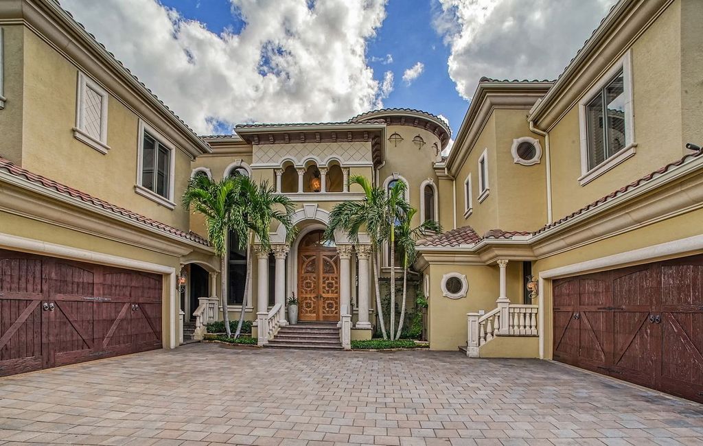 1436 John Ringling Parkway, Sarasota, Florida is a magnificent home in the coveted neighborhood of Lido Shores with impressive architectural details, beautiful chandeliers, custom woodwork, and pristine views of Sarasota Bay.