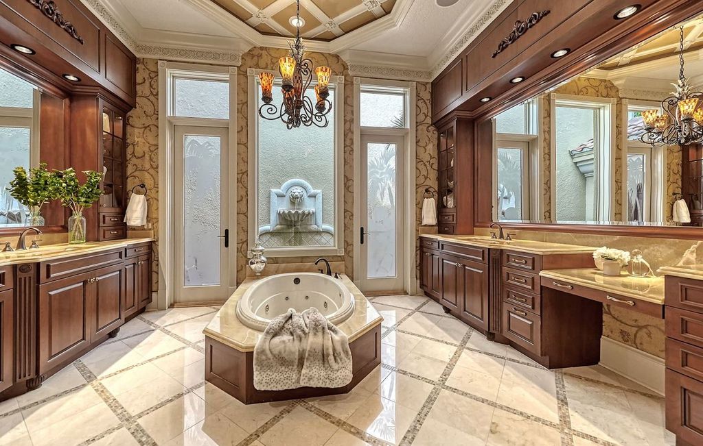 1436 John Ringling Parkway, Sarasota, Florida is a magnificent home in the coveted neighborhood of Lido Shores with impressive architectural details, beautiful chandeliers, custom woodwork, and pristine views of Sarasota Bay.