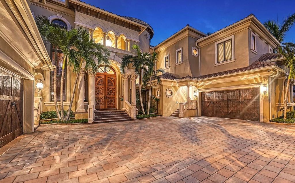 1436 John Ringling Parkway, Sarasota, Florida is a magnificent home in the coveted neighborhood of Lido Shores with impressive architectural details, beautiful chandeliers, custom woodwork, and pristine views of Sarasota Bay.
