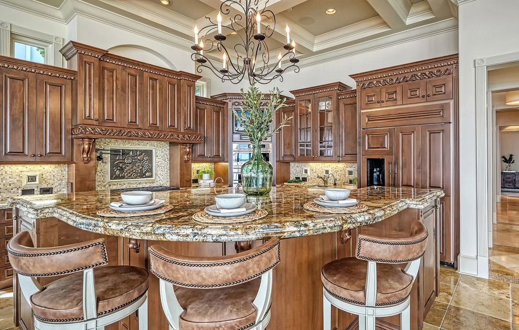 1436 John Ringling Parkway, Sarasota, Florida is a magnificent home in the coveted neighborhood of Lido Shores with impressive architectural details, beautiful chandeliers, custom woodwork, and pristine views of Sarasota Bay.
