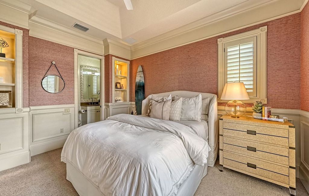 1436 John Ringling Parkway, Sarasota, Florida is a magnificent home in the coveted neighborhood of Lido Shores with impressive architectural details, beautiful chandeliers, custom woodwork, and pristine views of Sarasota Bay.