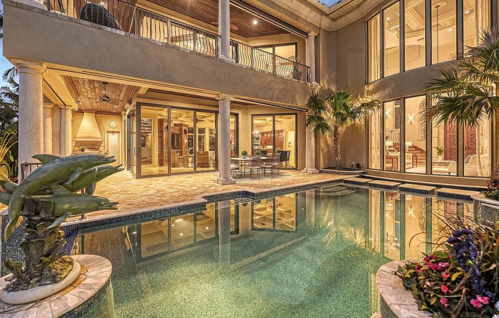 1436 John Ringling Parkway, Sarasota, Florida is a magnificent home in the coveted neighborhood of Lido Shores with impressive architectural details, beautiful chandeliers, custom woodwork, and pristine views of Sarasota Bay.