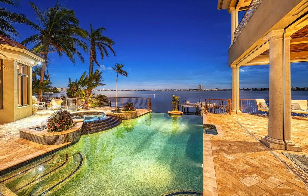1436 John Ringling Parkway, Sarasota, Florida is a magnificent home in the coveted neighborhood of Lido Shores with impressive architectural details, beautiful chandeliers, custom woodwork, and pristine views of Sarasota Bay.
