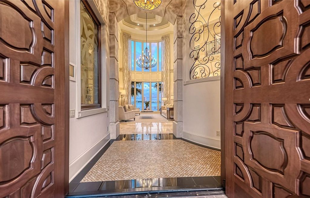 1436 John Ringling Parkway, Sarasota, Florida is a magnificent home in the coveted neighborhood of Lido Shores with impressive architectural details, beautiful chandeliers, custom woodwork, and pristine views of Sarasota Bay.