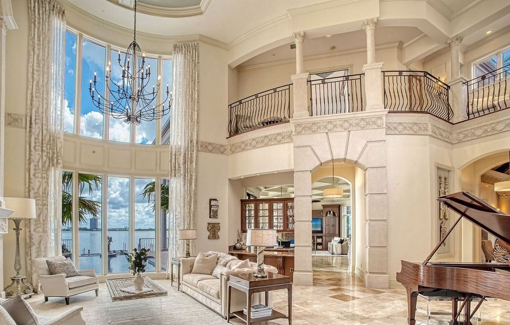 1436 John Ringling Parkway, Sarasota, Florida is a magnificent home in the coveted neighborhood of Lido Shores with impressive architectural details, beautiful chandeliers, custom woodwork, and pristine views of Sarasota Bay.