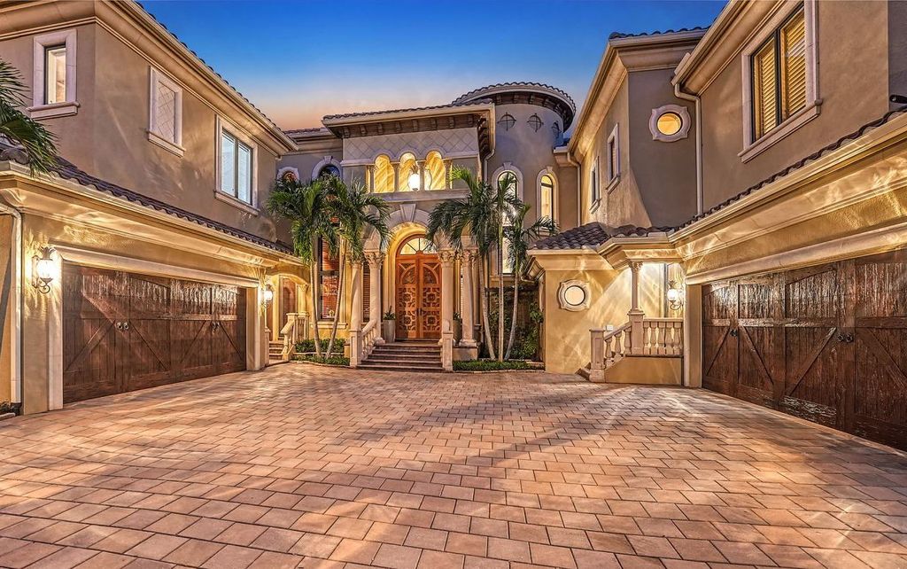 1436 John Ringling Parkway, Sarasota, Florida is a magnificent home in the coveted neighborhood of Lido Shores with impressive architectural details, beautiful chandeliers, custom woodwork, and pristine views of Sarasota Bay.