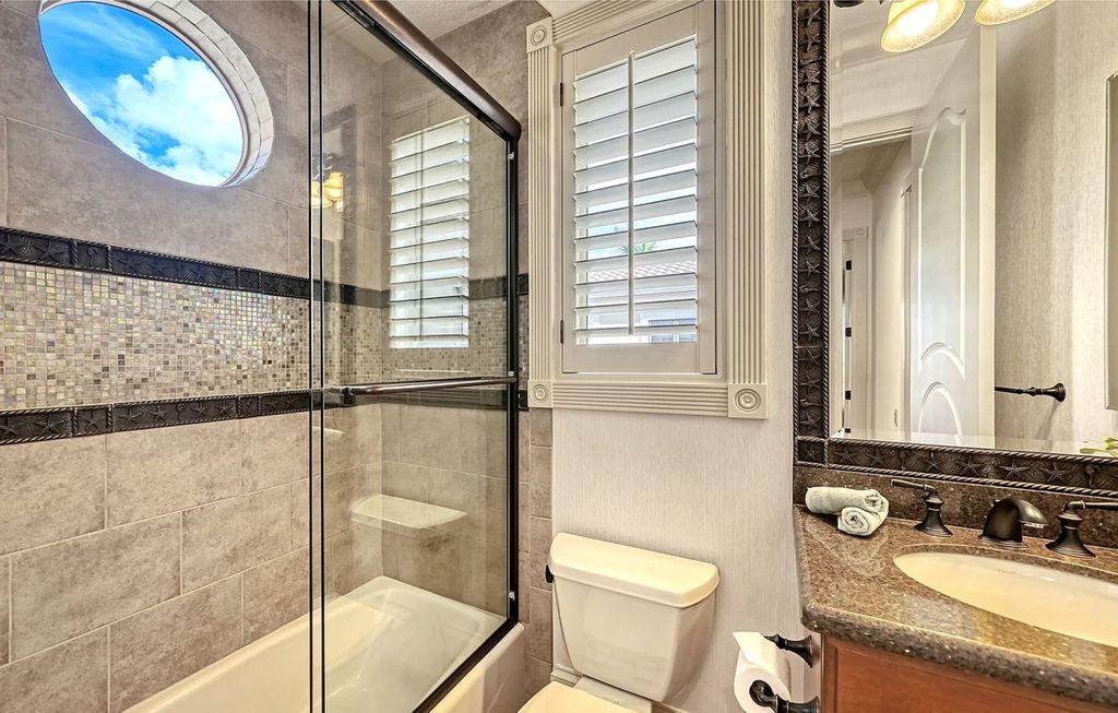 1436 John Ringling Parkway, Sarasota, Florida is a magnificent home in the coveted neighborhood of Lido Shores with impressive architectural details, beautiful chandeliers, custom woodwork, and pristine views of Sarasota Bay.