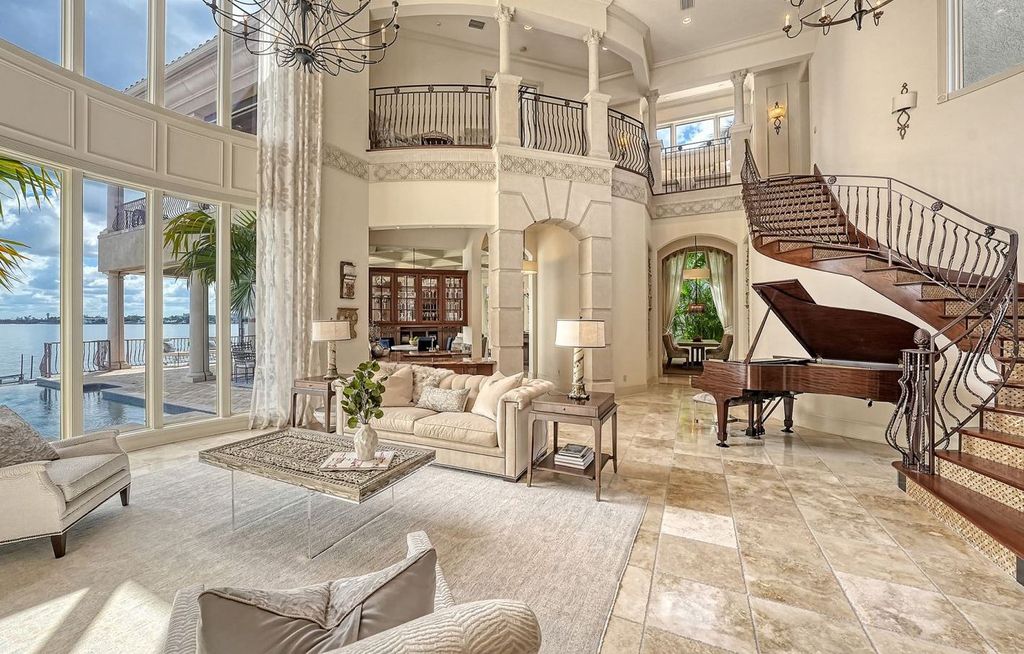 1436 John Ringling Parkway, Sarasota, Florida is a magnificent home in the coveted neighborhood of Lido Shores with impressive architectural details, beautiful chandeliers, custom woodwork, and pristine views of Sarasota Bay.