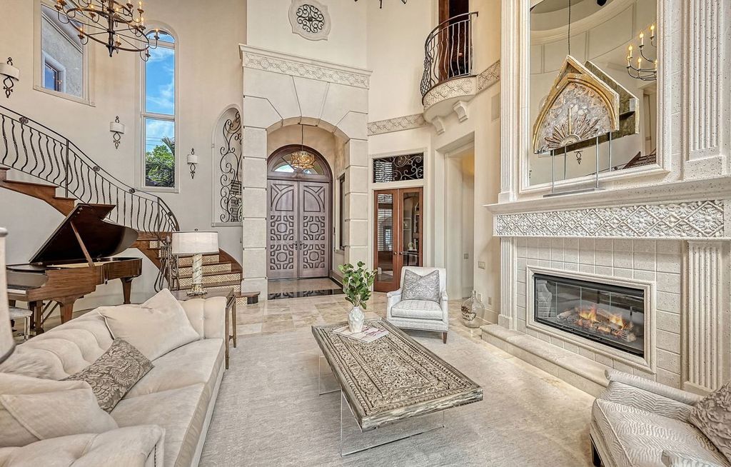 1436 John Ringling Parkway, Sarasota, Florida is a magnificent home in the coveted neighborhood of Lido Shores with impressive architectural details, beautiful chandeliers, custom woodwork, and pristine views of Sarasota Bay.