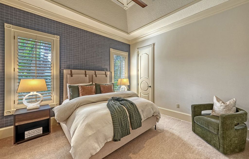 1436 John Ringling Parkway, Sarasota, Florida is a magnificent home in the coveted neighborhood of Lido Shores with impressive architectural details, beautiful chandeliers, custom woodwork, and pristine views of Sarasota Bay.