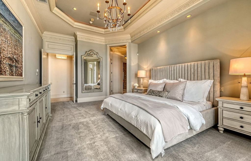 1436 John Ringling Parkway, Sarasota, Florida is a magnificent home in the coveted neighborhood of Lido Shores with impressive architectural details, beautiful chandeliers, custom woodwork, and pristine views of Sarasota Bay.