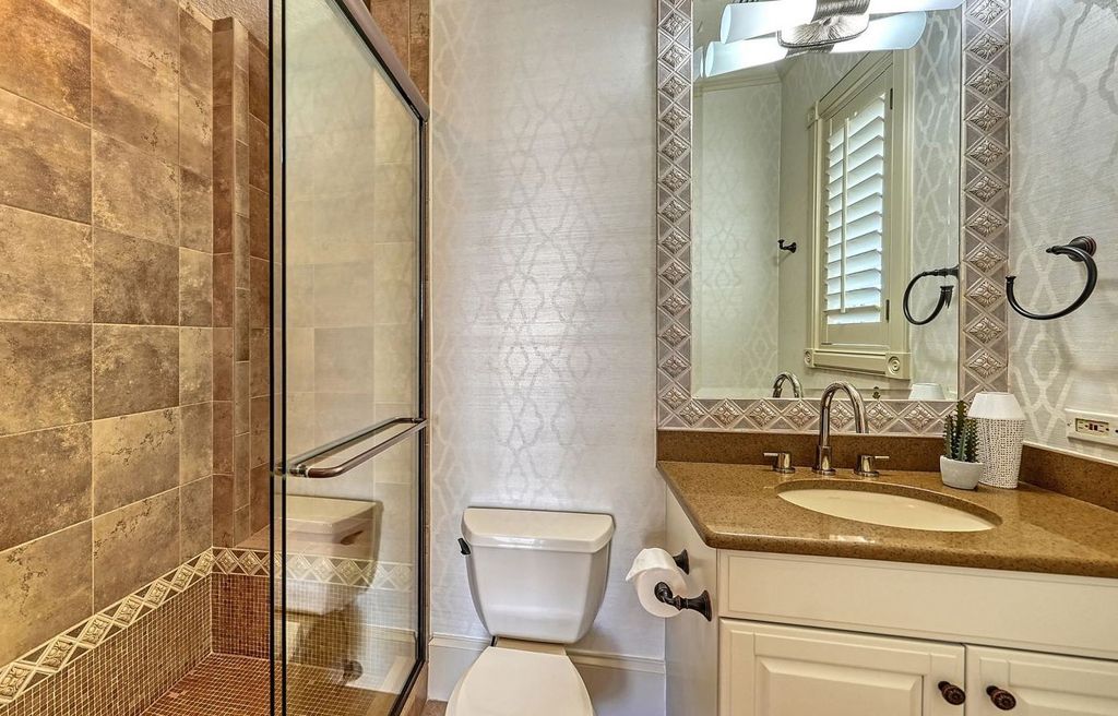 1436 John Ringling Parkway, Sarasota, Florida is a magnificent home in the coveted neighborhood of Lido Shores with impressive architectural details, beautiful chandeliers, custom woodwork, and pristine views of Sarasota Bay.