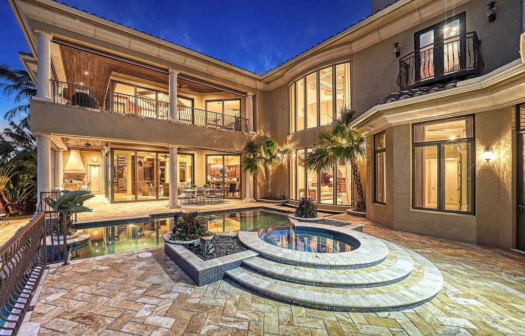 1436 John Ringling Parkway, Sarasota, Florida is a magnificent home in the coveted neighborhood of Lido Shores with impressive architectural details, beautiful chandeliers, custom woodwork, and pristine views of Sarasota Bay.
