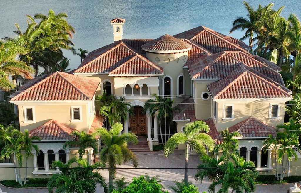 1436 John Ringling Parkway, Sarasota, Florida is a magnificent home in the coveted neighborhood of Lido Shores with impressive architectural details, beautiful chandeliers, custom woodwork, and pristine views of Sarasota Bay.