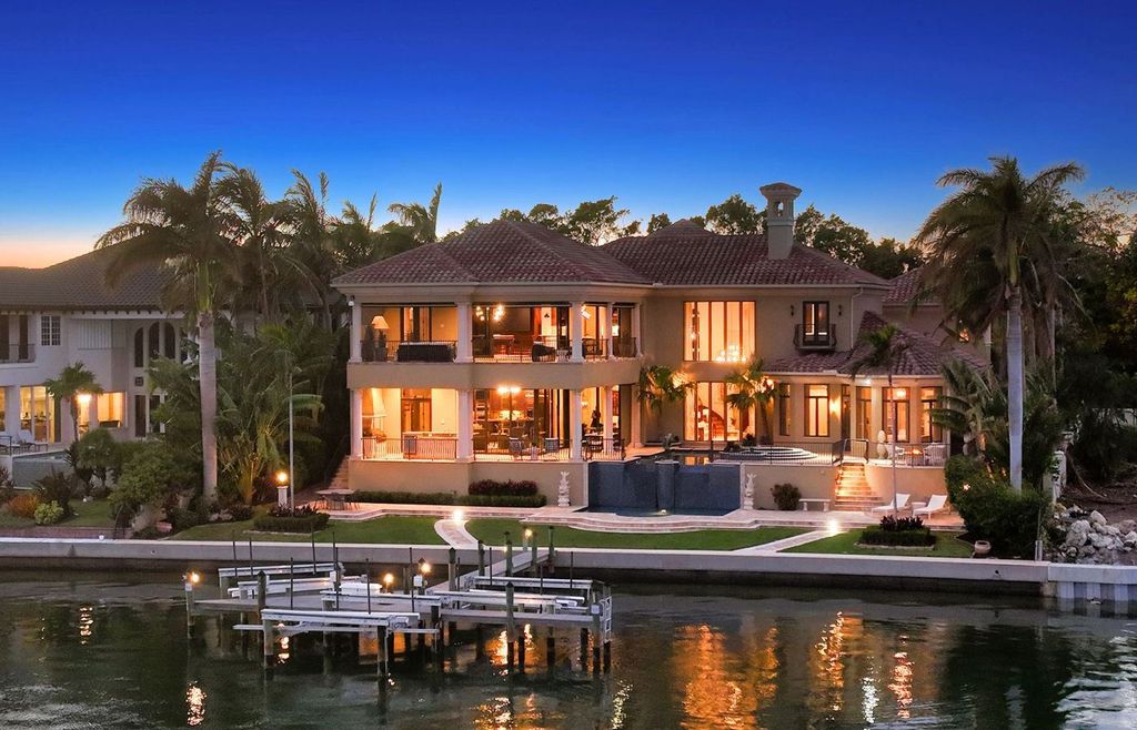 1436 John Ringling Parkway, Sarasota, Florida is a magnificent home in the coveted neighborhood of Lido Shores with impressive architectural details, beautiful chandeliers, custom woodwork, and pristine views of Sarasota Bay.