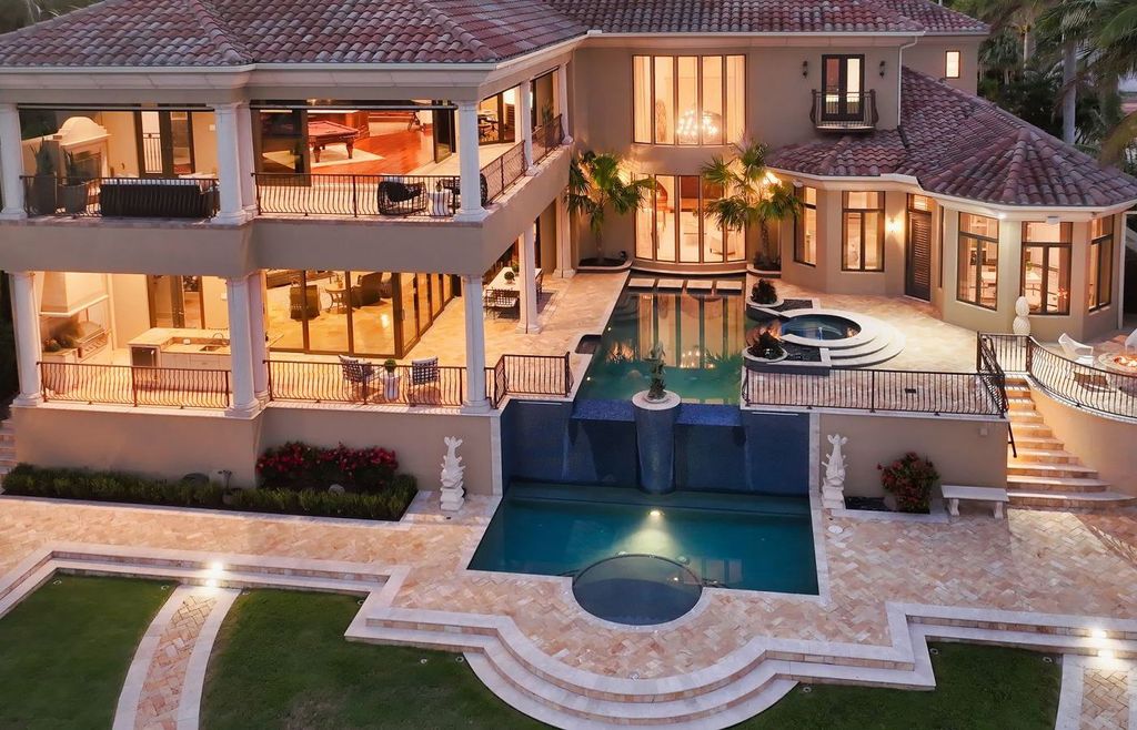 1436 John Ringling Parkway, Sarasota, Florida is a magnificent home in the coveted neighborhood of Lido Shores with impressive architectural details, beautiful chandeliers, custom woodwork, and pristine views of Sarasota Bay.