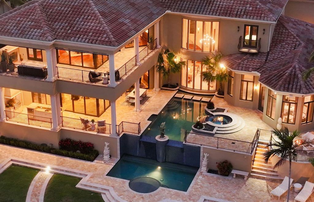 1436 John Ringling Parkway, Sarasota, Florida is a magnificent home in the coveted neighborhood of Lido Shores with impressive architectural details, beautiful chandeliers, custom woodwork, and pristine views of Sarasota Bay.