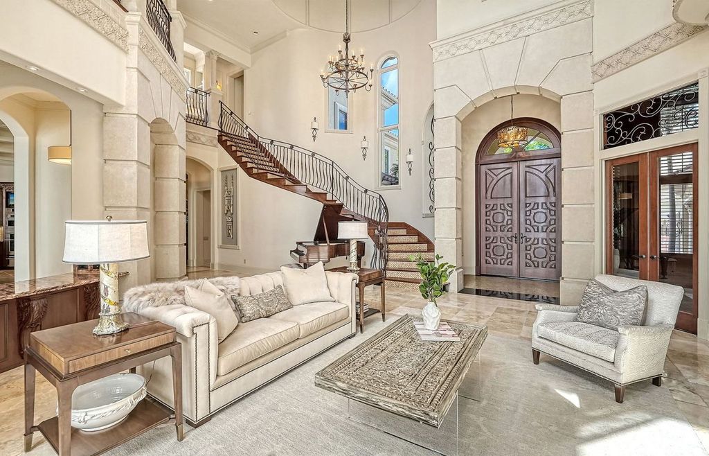 1436 John Ringling Parkway, Sarasota, Florida is a magnificent home in the coveted neighborhood of Lido Shores with impressive architectural details, beautiful chandeliers, custom woodwork, and pristine views of Sarasota Bay.