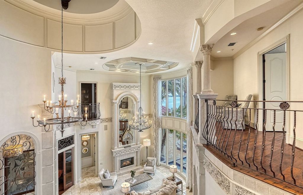 1436 John Ringling Parkway, Sarasota, Florida is a magnificent home in the coveted neighborhood of Lido Shores with impressive architectural details, beautiful chandeliers, custom woodwork, and pristine views of Sarasota Bay.
