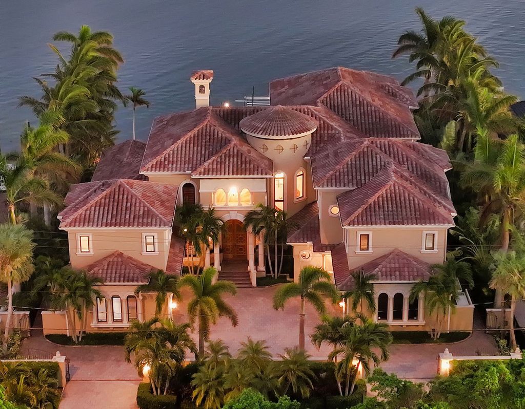 1436 John Ringling Parkway, Sarasota, Florida is a magnificent home in the coveted neighborhood of Lido Shores with impressive architectural details, beautiful chandeliers, custom woodwork, and pristine views of Sarasota Bay.
