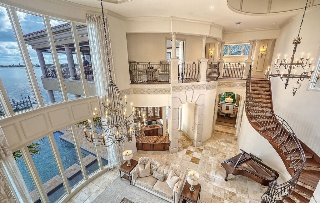 1436 John Ringling Parkway, Sarasota, Florida is a magnificent home in the coveted neighborhood of Lido Shores with impressive architectural details, beautiful chandeliers, custom woodwork, and pristine views of Sarasota Bay.