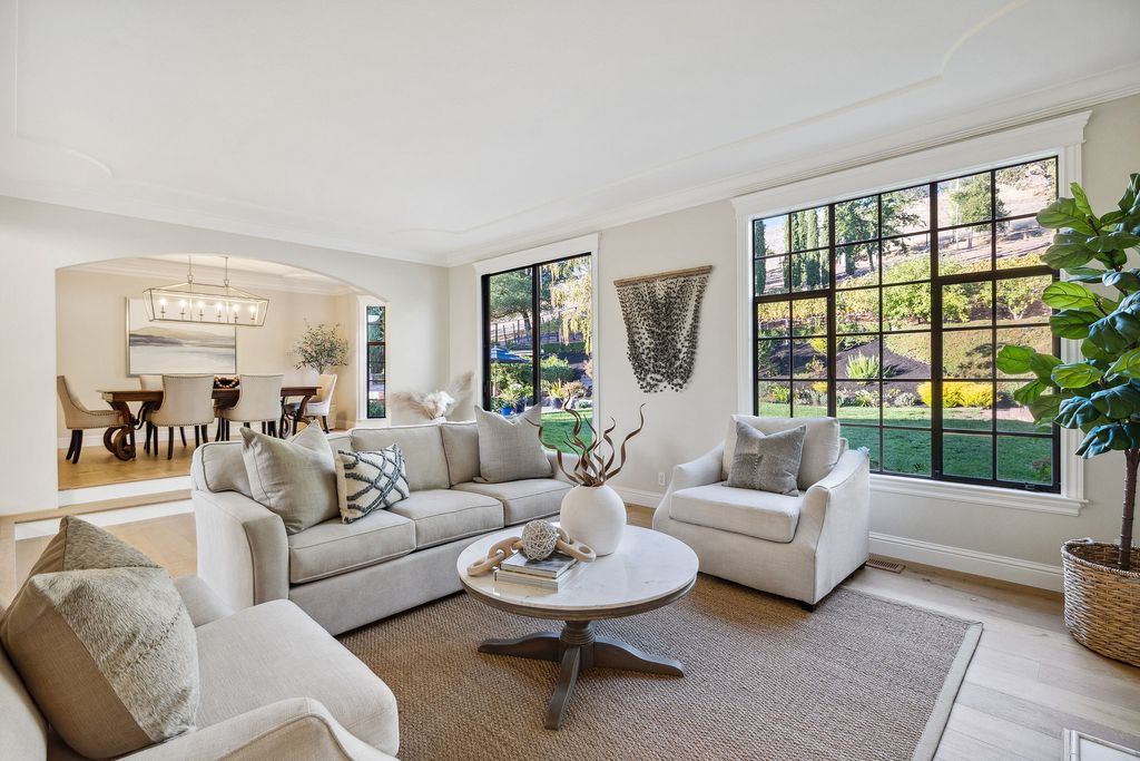 1941 Parkmont Drive, Alamo, California is beautiful remodeled custom home features a resort-like backyard with pool, spa, outdoor kitchen, built-in fire pit, bocce court, expansive level grassy area to play, sport court location, producing vineyard, vegetable garden beds, & fruit trees.