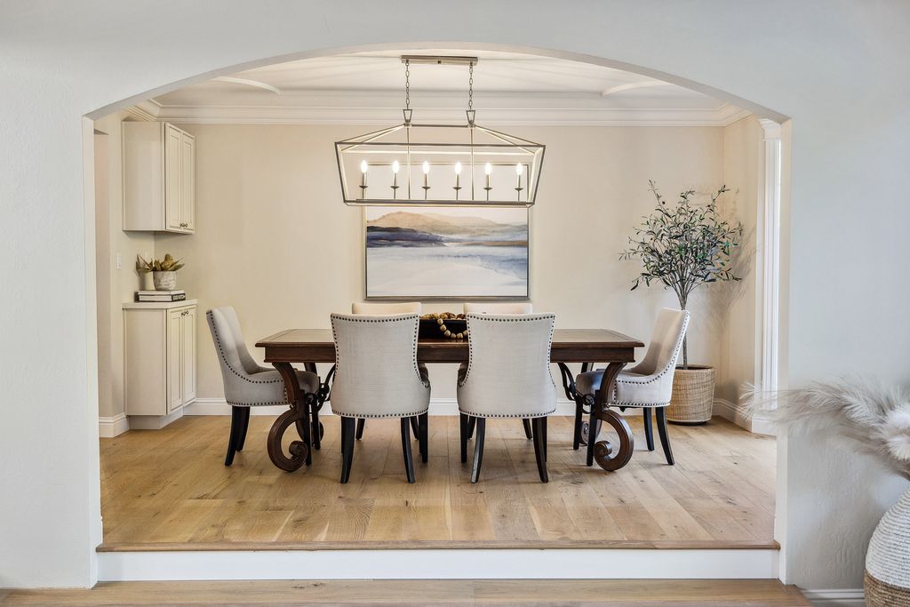 1941 Parkmont Drive, Alamo, California is beautiful remodeled custom home features a resort-like backyard with pool, spa, outdoor kitchen, built-in fire pit, bocce court, expansive level grassy area to play, sport court location, producing vineyard, vegetable garden beds, & fruit trees.