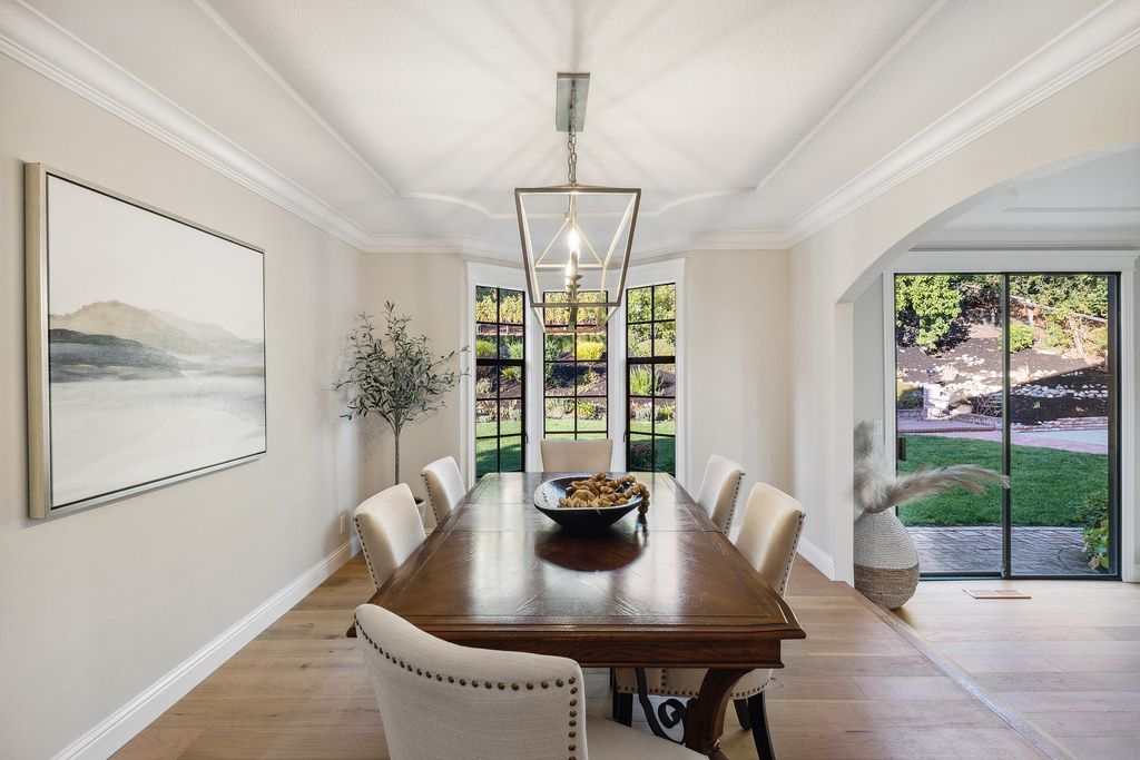 1941 Parkmont Drive, Alamo, California is beautiful remodeled custom home features a resort-like backyard with pool, spa, outdoor kitchen, built-in fire pit, bocce court, expansive level grassy area to play, sport court location, producing vineyard, vegetable garden beds, & fruit trees.