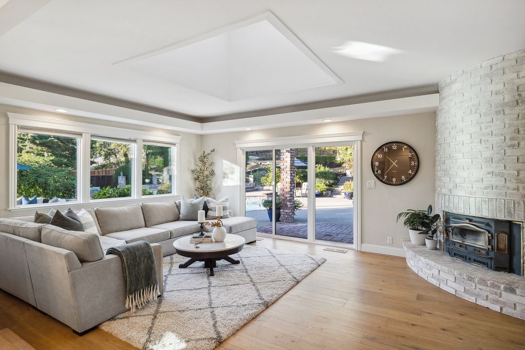 1941 Parkmont Drive, Alamo, California is beautiful remodeled custom home features a resort-like backyard with pool, spa, outdoor kitchen, built-in fire pit, bocce court, expansive level grassy area to play, sport court location, producing vineyard, vegetable garden beds, & fruit trees.